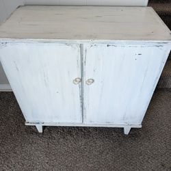 White Cabinet with Navy Blue Accents 