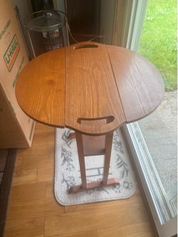 Small round wood table. Heavy Oak