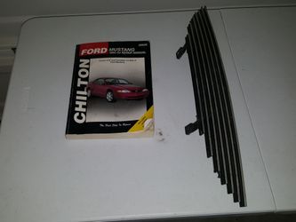 Ford Mustang repair book and billet grill