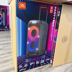 Powerful JBL PartyBox Stage 320 speaker. New in box. This portable speaker has an adaptive light show, Bluetooth, telescopic handle and wheels, and is