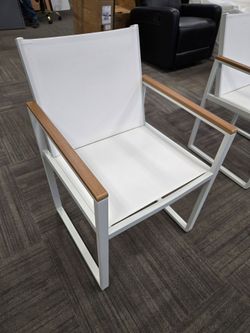 White Outdoor Sling Chair with Wood Armrests. $45/each. 6 available