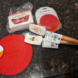 Cerise Nine Piece Le Creuset Silicone Trivet, Coasters, Pot Grips, & Spatulas