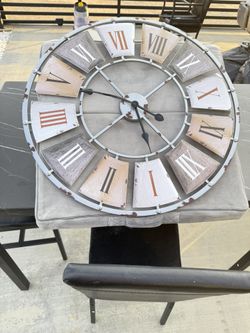 large metal wall clock