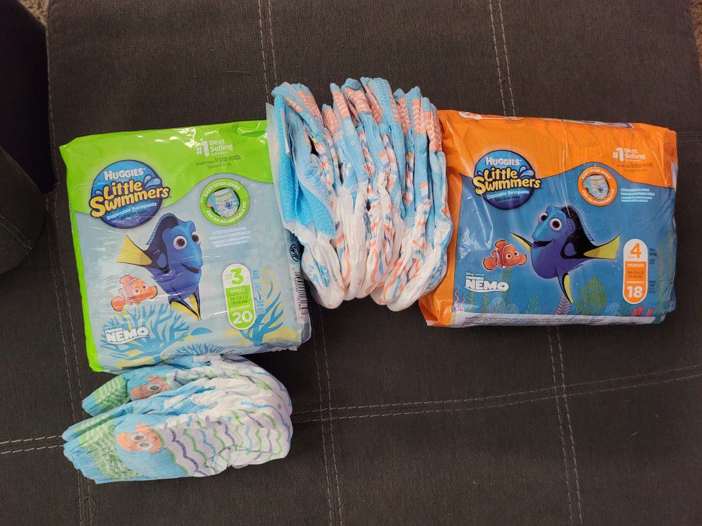 Toddler Swim Diapers Size 3 & 4. Extras included.