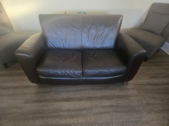 Brown leather love seat/sofa