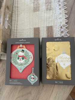 Two (2) new boxes of Christmas Cards. One of 10 and one of 16 Hallmark cards. Both $12. 