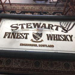Leather padded Stewart mirrored whiskey coffee table