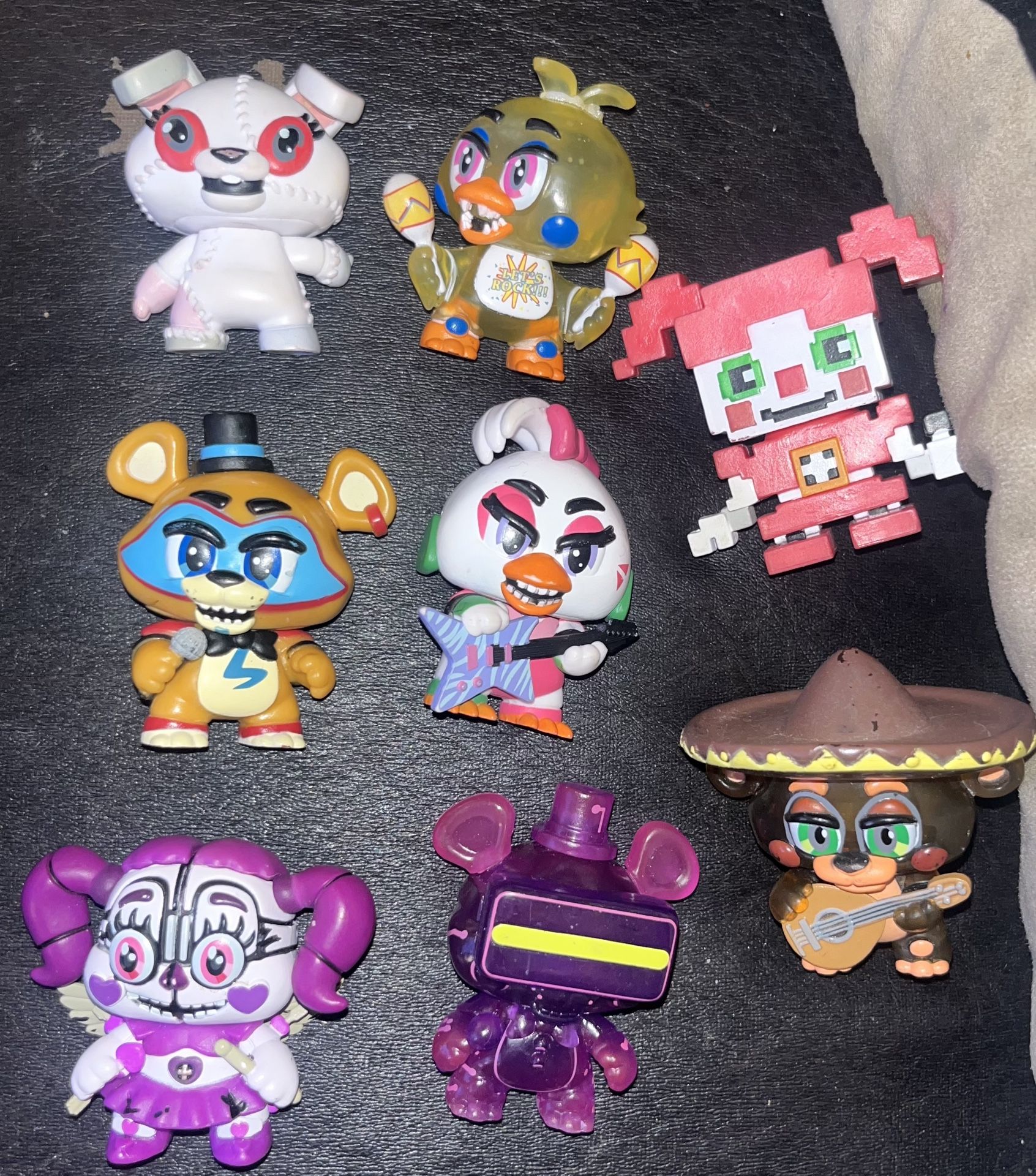 Preowned 8 - Funko Five nights at freddy’s security breech mystery minis all in great condition . Located Off lake mead and Simmons area asking $15 fo