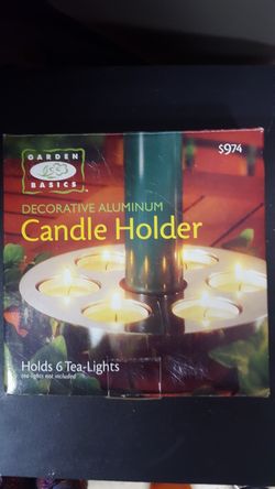 Brand new - I have 2- each one is 8.00- candle holder hold 6 tea lights made out of aluminum can be left outside