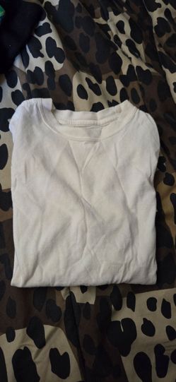 Two young boys shirts one black and one white both size 6/7