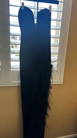 Long black strapless dress with long fur split