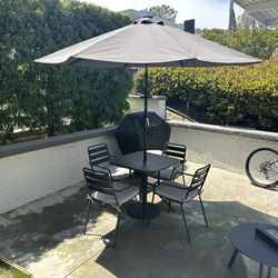 Outdoor Table, Chairs, and Umbrella 