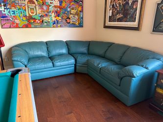 Teal green leather sectional couch