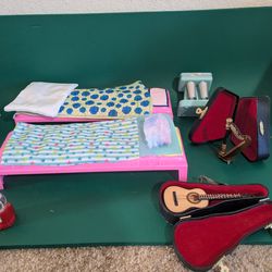 Toy dollhouse furniture and miniature harp and guitar