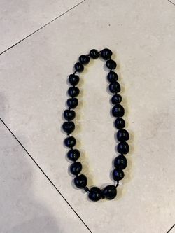 Hawaiian Lei Necklace of Black Kukui Nuts Individually Knotted.