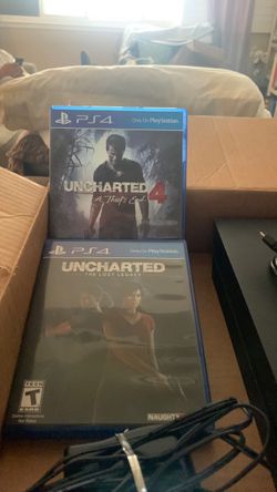 PlayStation 4 console W/ 2 controllers (1 Black, 1 Blue & black) Duel charging station W/ Cord & Two video games