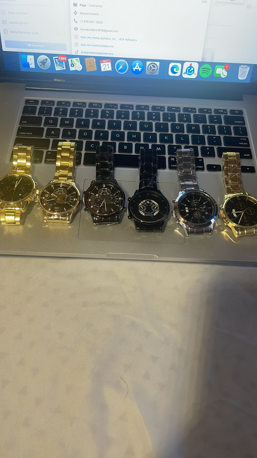 7 watches — all brand new, still wrapped in plastic and with the original protective lock in place.