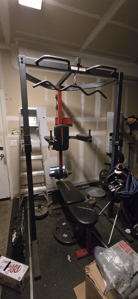 power tower with pull-up bar and adjustable bench.