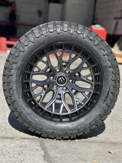 Fuel sigma 20x10 6x139.7 with 33x12.50r20 venom R/T tires 10plys available we finance 