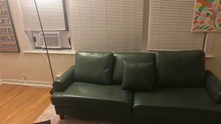 Green Leather Sofa with Throw Pillow