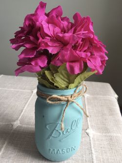 Distressed mason jar vase with silk flowers