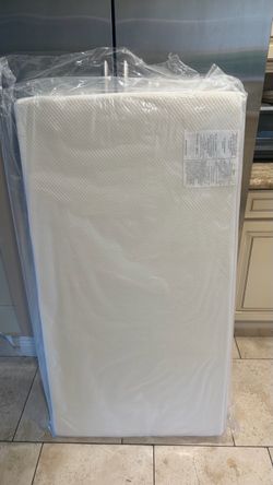 White Crib Mattress Still in Plastic
