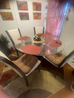 Round glass table with 4 chairs