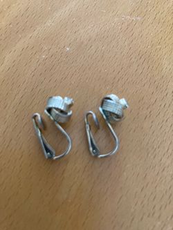 A pair very distinctive pair of vintage clip-on earrings from the 1930s–1960s.