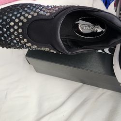 Mk, black top, white bottom with rhinestones. Size 6