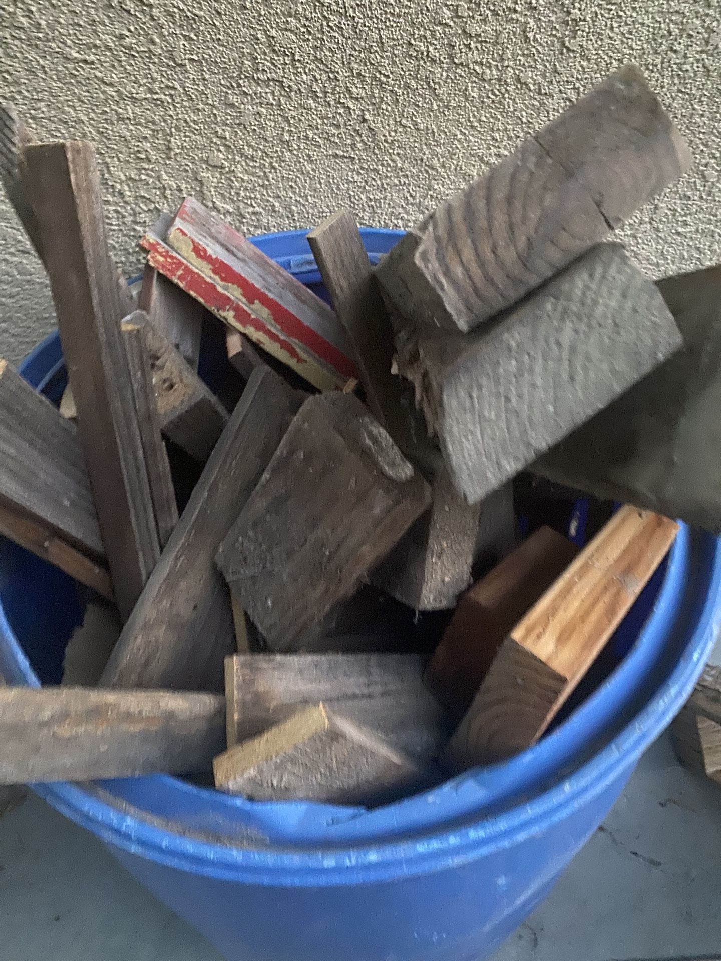 Barrel full of scrap wood for burning