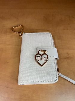 Juicy Couture Simply Perfect tab card wallet with a gold heart charm and embossed logo.