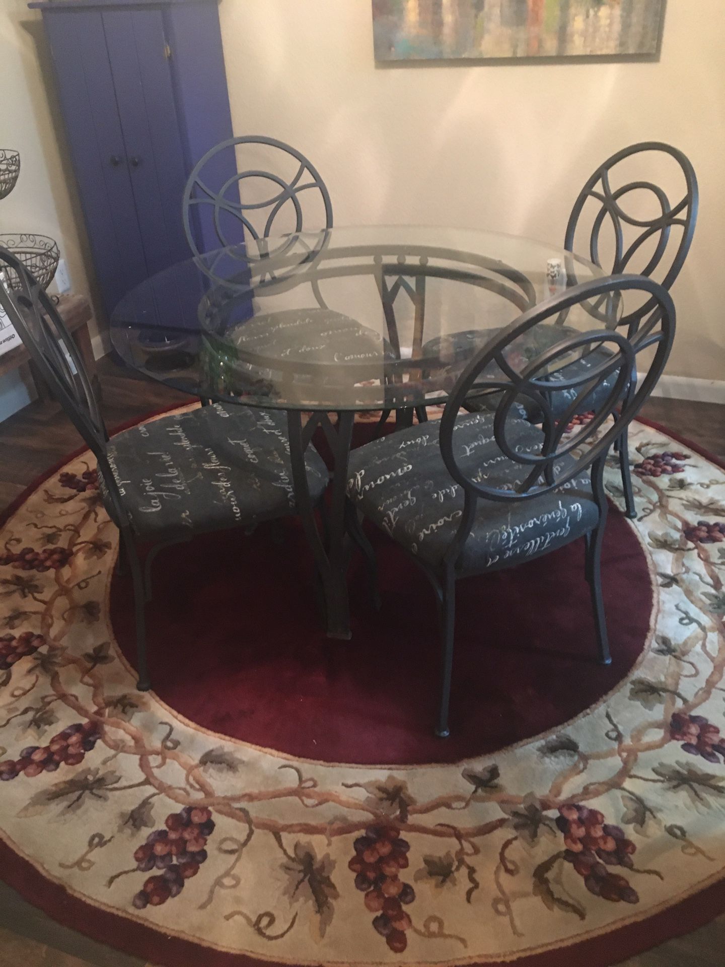 Dining room table, chairs, round rug