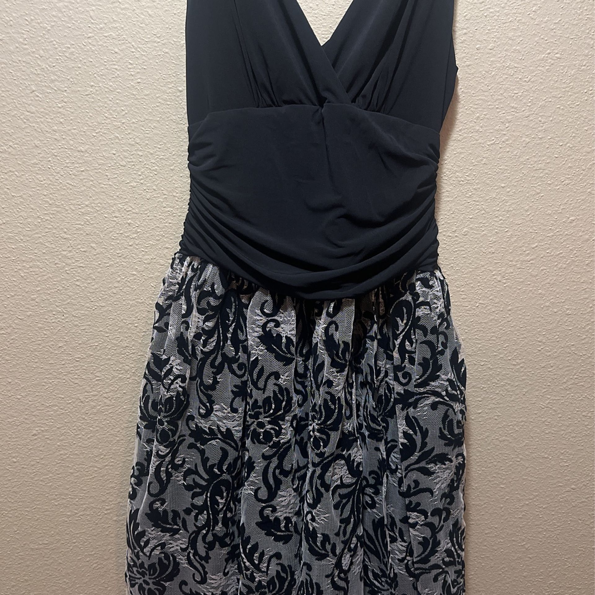 Beautiful black V Cut Too Dress Size 12