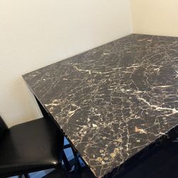 Dining table and two chairs