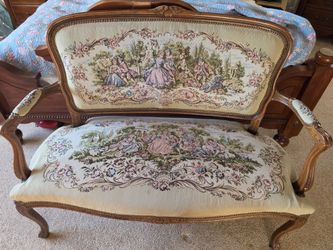 Vintage sette with accompanying chair.