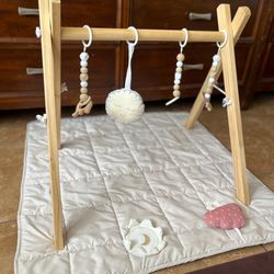 Wooden infant play gym with mat