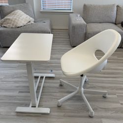 Height adjustable sit stand desk on wheels and IKEA loberget swivel chair