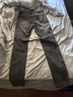 Size 28, grey ksubi jeans black rips.