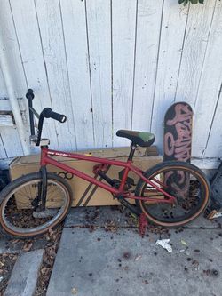 Hidden Valley BMX Bike Red and skate board