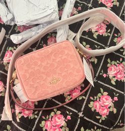 Coach pink denim large carey