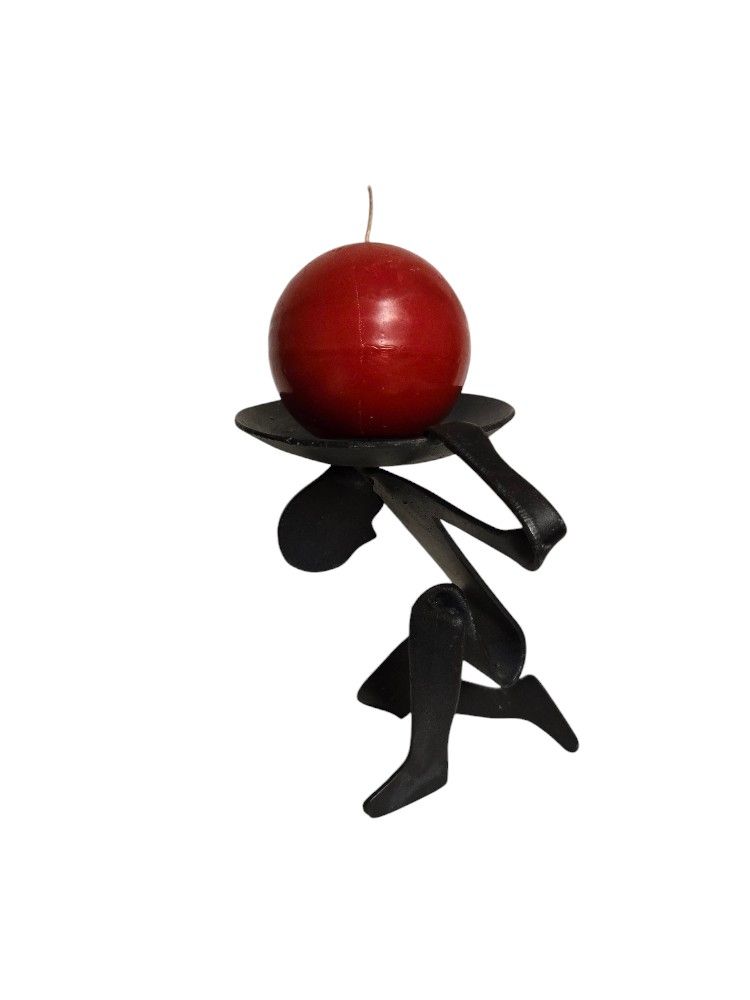 cast iron brutalist figurative candle holder man with world on shoulders