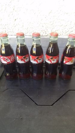 Coca-Cola holiday season bottles and then with rare reverse image on the bottle.