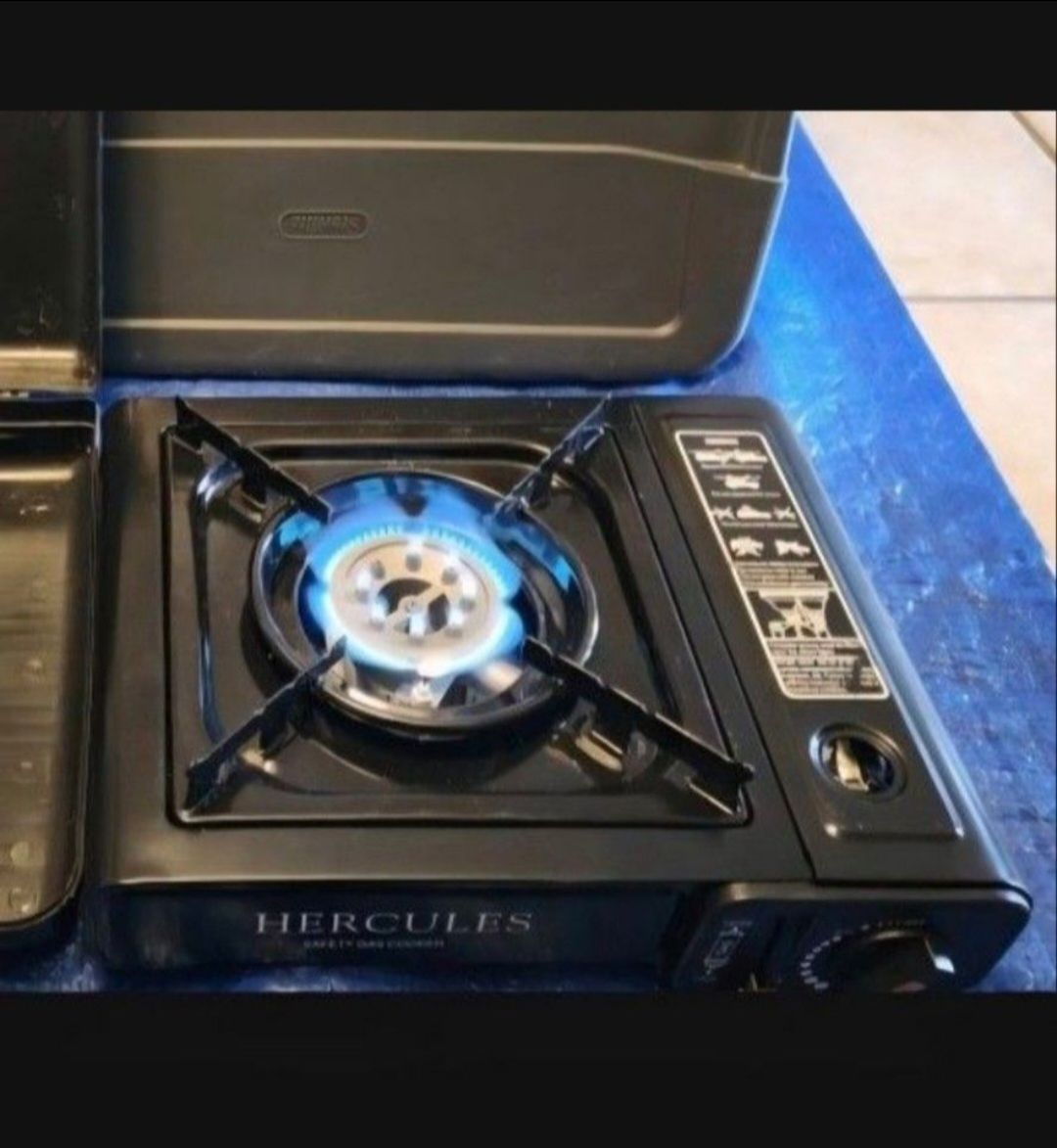 Hercules brand Butane Outdoor Cook Stovetop Camp Stove in a Case, 4 New Sterno Brand Cartridges. Also comes with 21 piece Ozark Trail 4 Person Table S