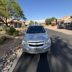 Silver Chevy suv 