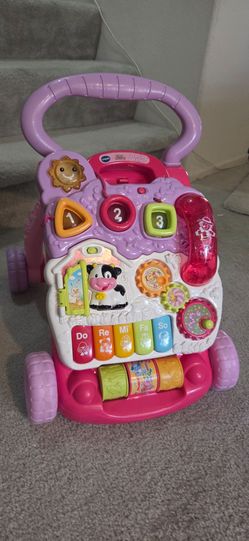 Pink Vtech sit and stand push walker