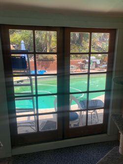 Double doors.  Wooden glass doors. Glass doors. Decorative