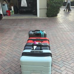 Four Suitcases With Locks And Fit A Lot Of Clothes