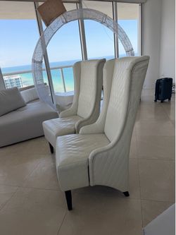 2 High Back Faux Leather Dining room chairs.