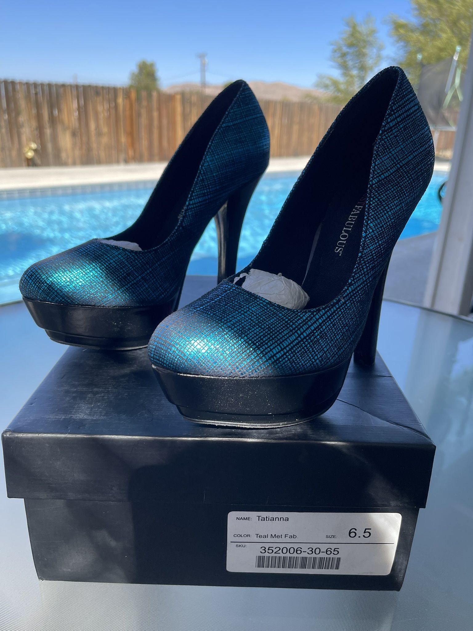 Woman’s Teal High Heel Pump