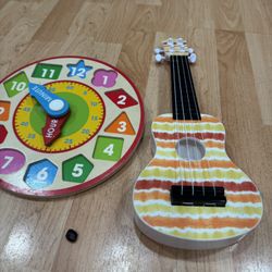 Toy Clock And Guitar